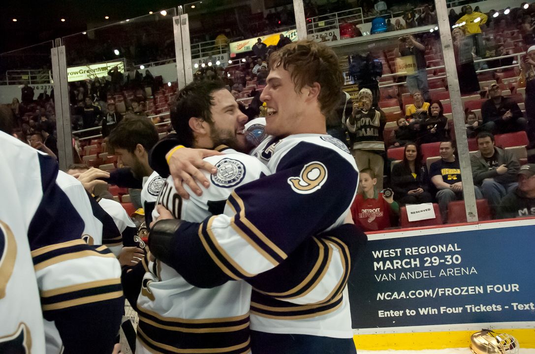 Notre Dame's newest captain - Jeff Costello (left) - celebrates the 2013 CCHA championship with former captain Anders Lee (right).