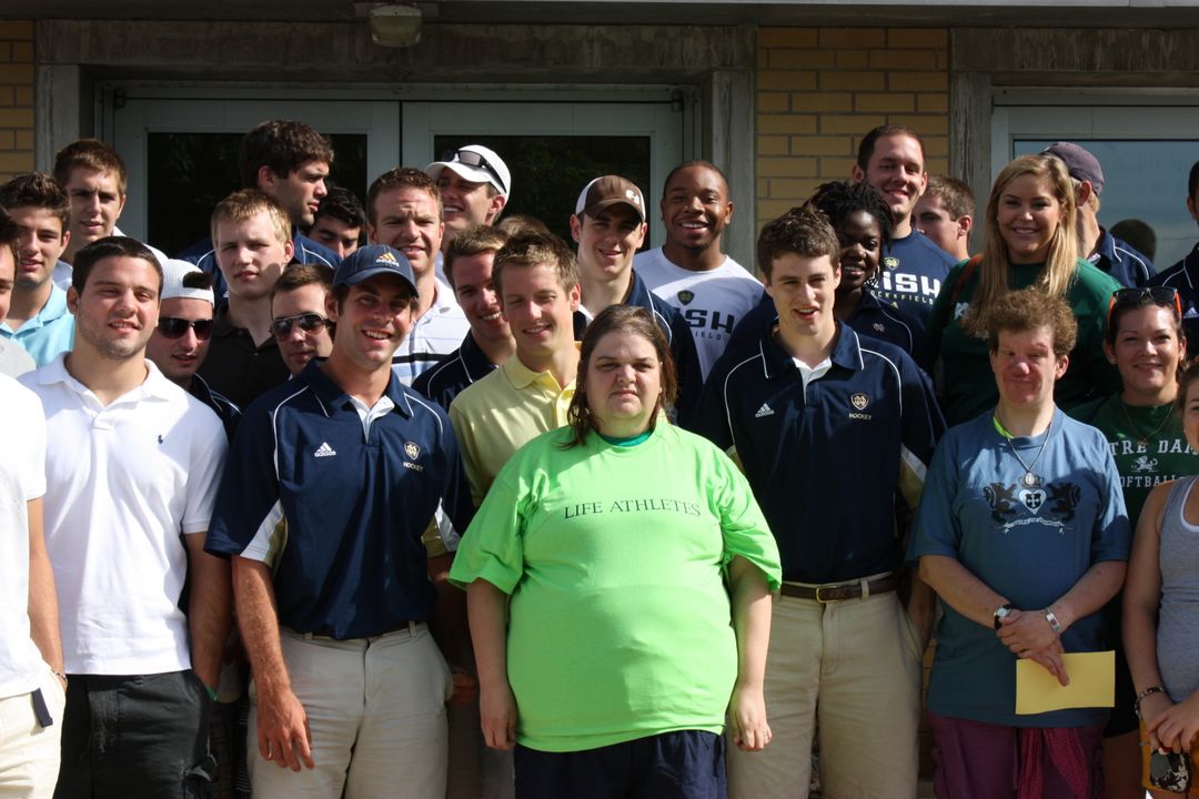 The track and field team at a volunteer event during the 2009-10 season.