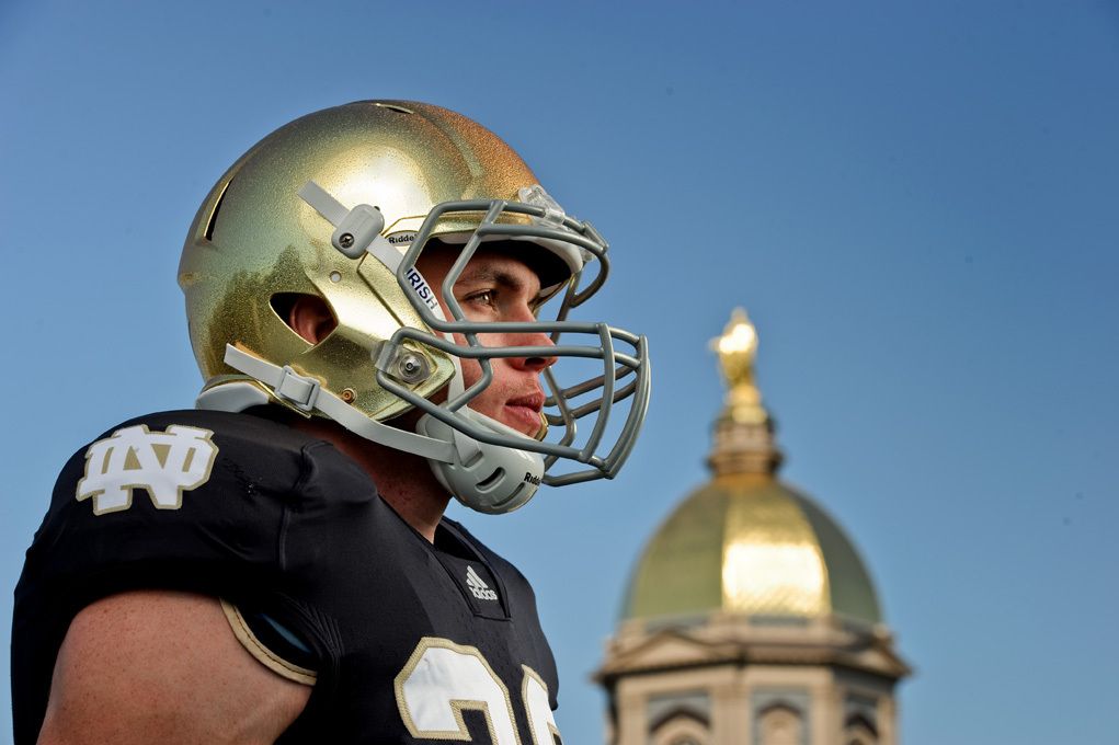 Senior captain Harrison Smith shows off the new Notre Dame football helmet.