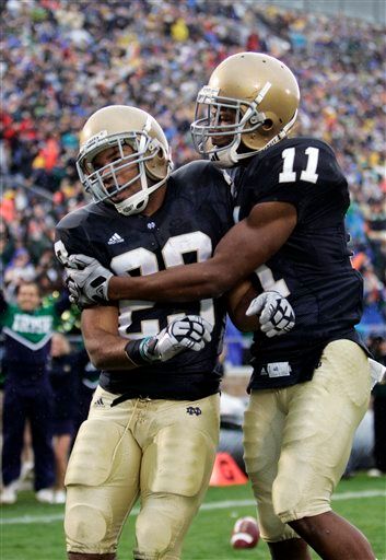 Golden Tate is congratulated by Shaquelle Evans after Tate raced 67 yards for a touchdown against Washington.