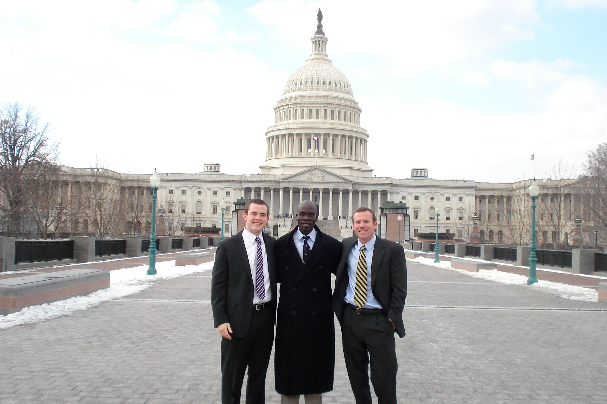 Irish Lacrosse Heads Delegation To Washington, D.C. To Stand With Sudan Jake Brems, Emmanuel Gore (Kroc Institute) and Kevin Dugan (left to right) in front of the Capitol Building.
