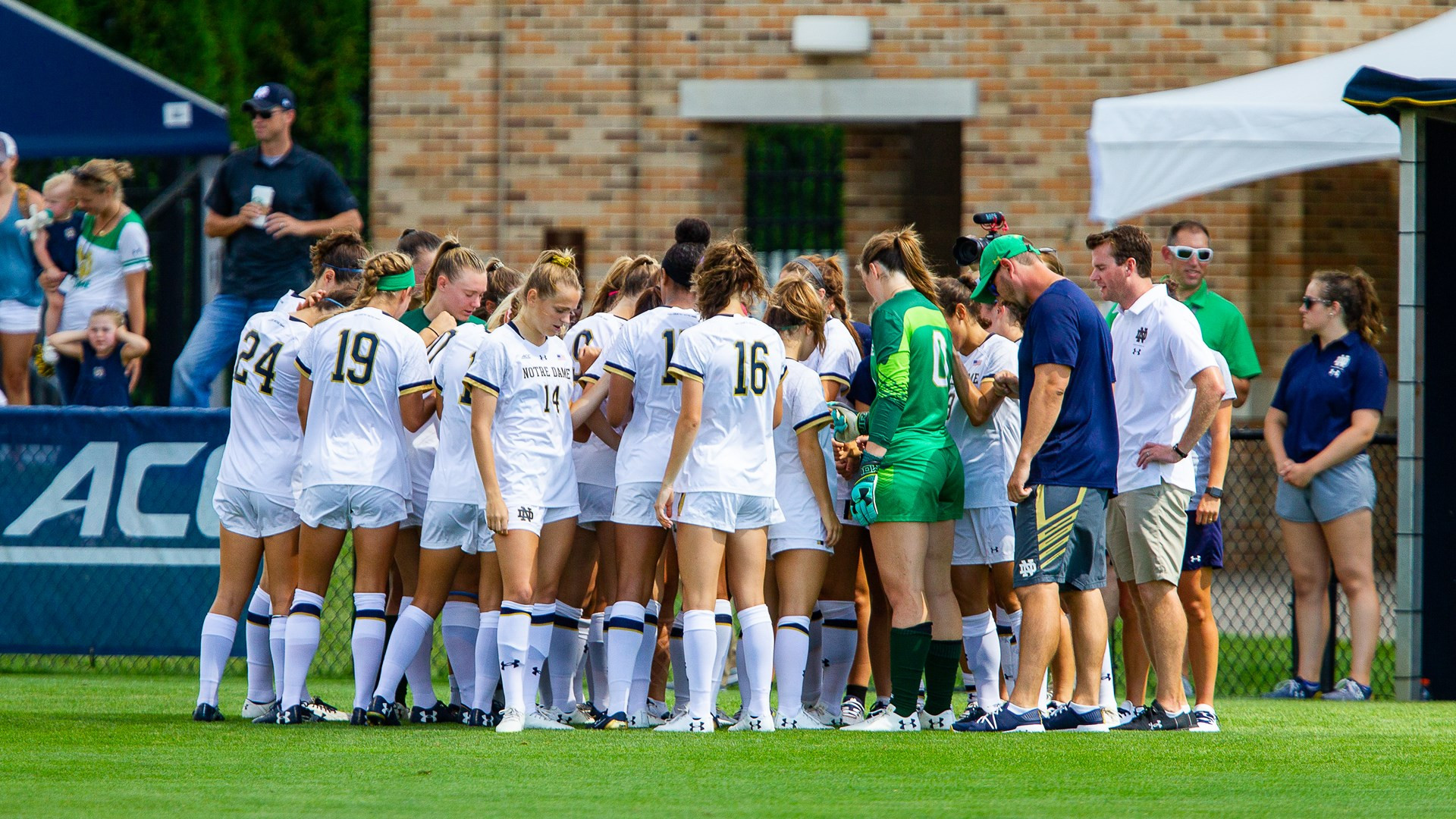 Register Now for Women’s Soccer Summer Camps team huddle