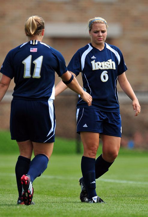 Senior forward/tri-captain Michele Weissenhofer (11) congratulates sophomore forward Melissa Henderson (6) after the latter scored the first of her two goals in Notre Dame's 3-0 victory over Wisconsin-Milwaukee on Sunday afternoon in the Inn at Saint Mary's Classic finale at Alumni Stadium.