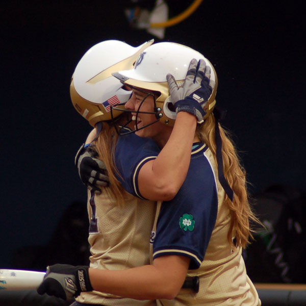 Late Run Seals Win For Notre Dame Softball Linda Kohan (left) and Beth Northway celebrate after Kohan scored the game-winning run in game one Thursday night against Loyola.
