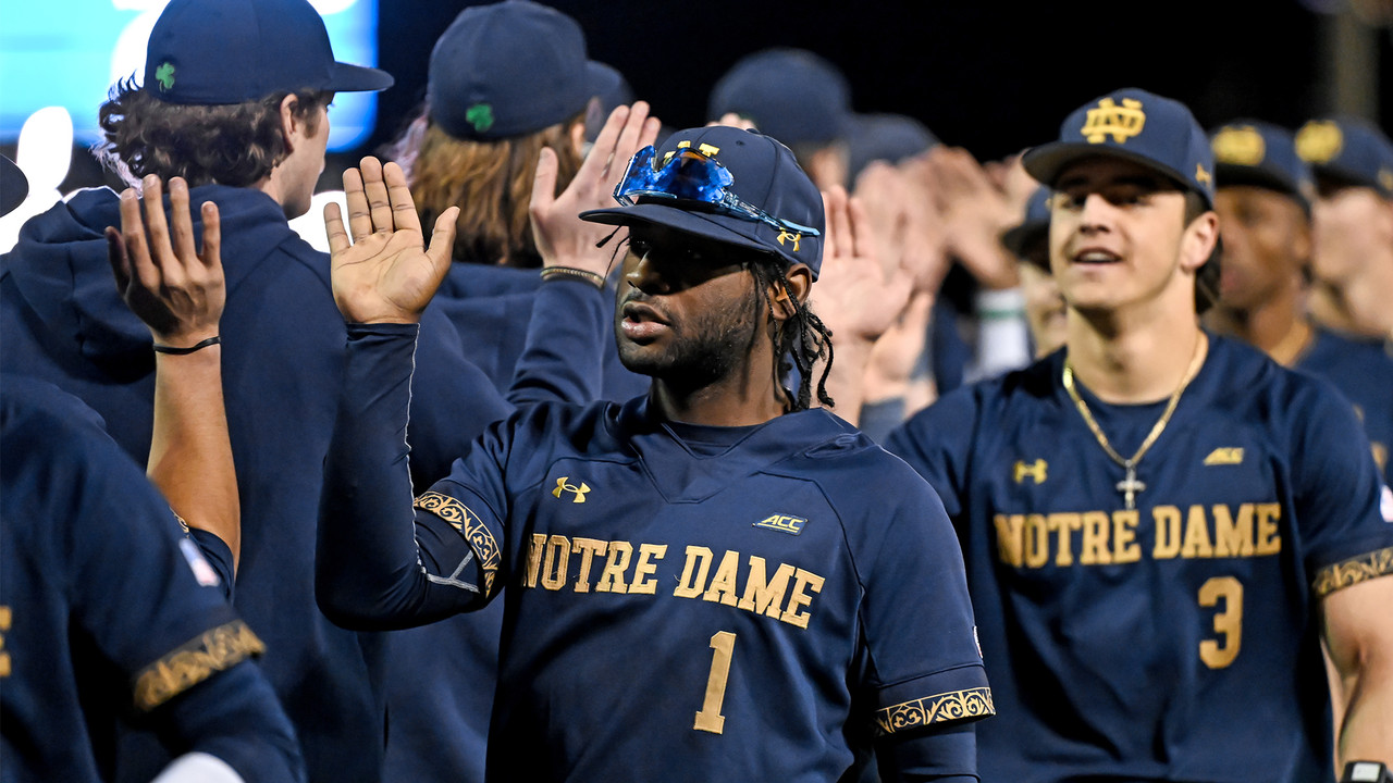 Players high five each other.