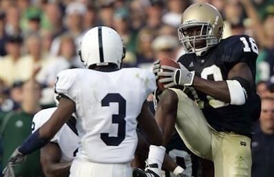 Notre Dame defender Chinedum Ndukwe, right, intercepts a pass intended for Penn State wide receiver Deon Butler in the third quarter.  (AP Photo/Michael Conroy)